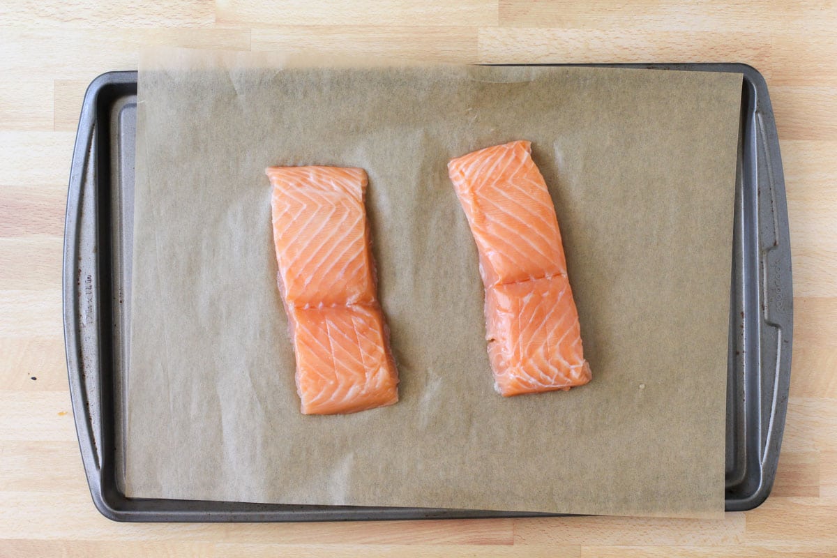 raw salmon on sheet pan