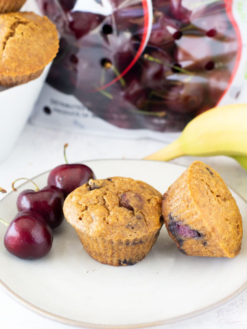 banana cherry muffins surrounced by banana cherries and more muffins