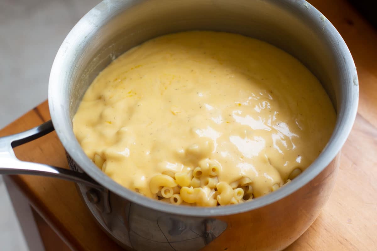 healthy homemade mac and cheese stirring