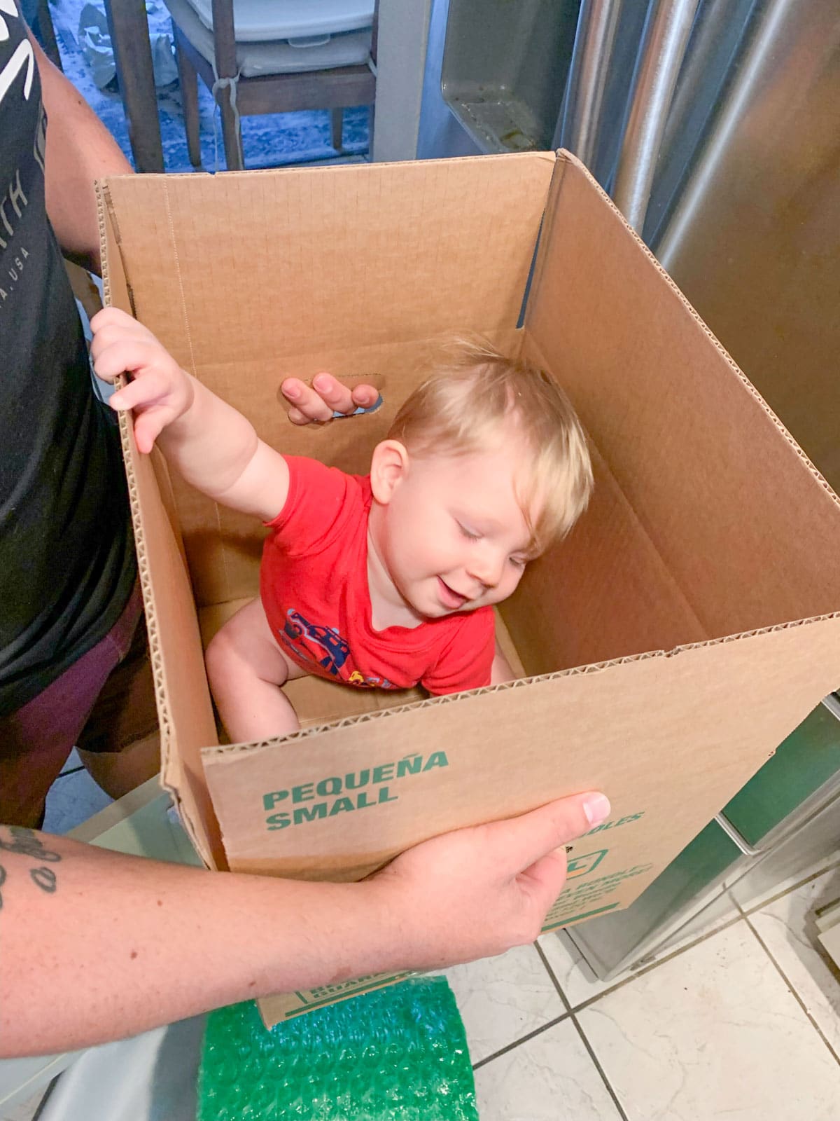 baby in moving box